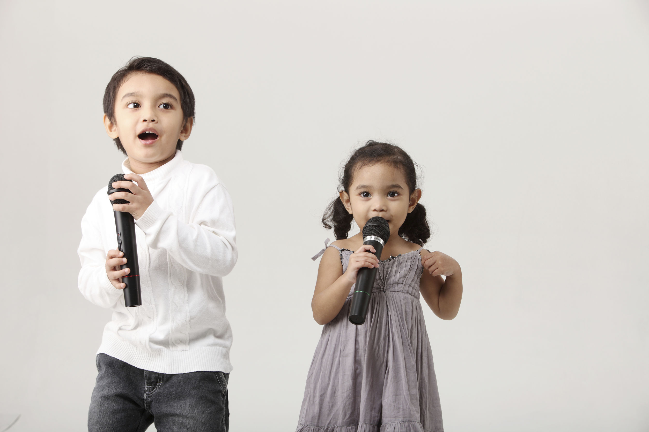 sister and brother sing together