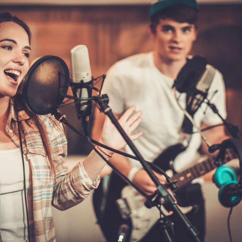 Music band performing in a recording studio Music band performing in a recording studio
